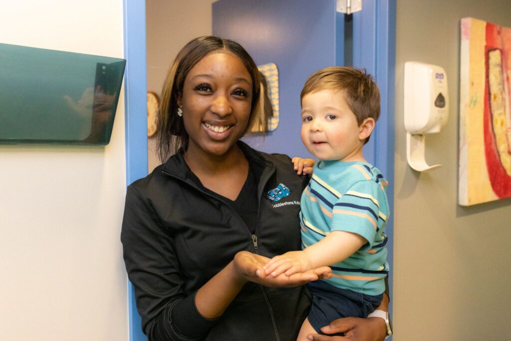 Infant Dental Exams 3 A Cobblestone Kids Team Member Holding A Relaxed Toddler After An Infant Dental Exam In Philadelphia, Pa