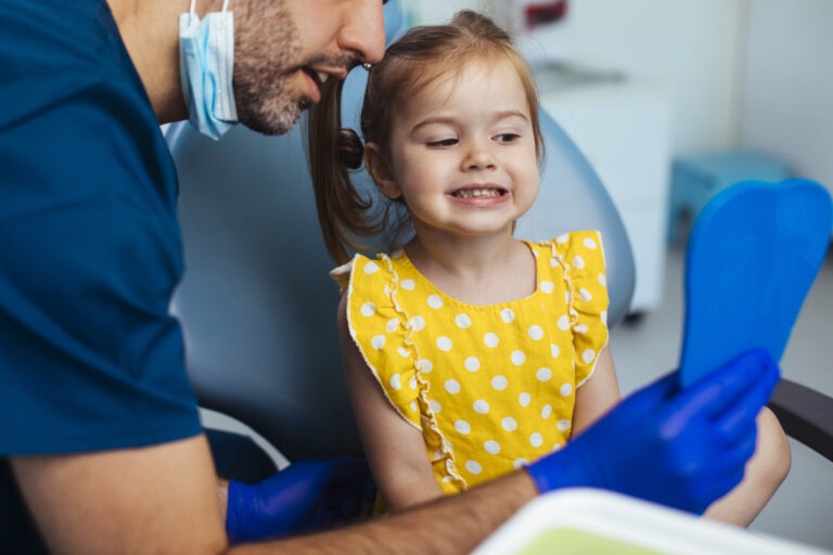 First Pediatric Dentist Visit 3 A Happy Child With Her Pediatric Dentist After Safe Pediatric Dentistry Under General Anesthesia At Cobblestone Kids In Glen Mills, Pa