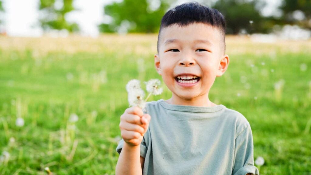 Emergency Pediatric Dentistry 2 A Smiling Boy Holding A Toothbrush After Kids Urgent Dental Care From Our Emergency Pediatric Dentist In Glen Mills, Pa