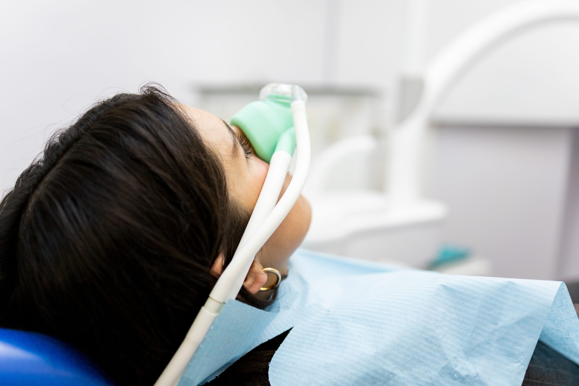 An,Adult,Woman,Sits,In,A,Dentist's,Clinic,Wearing,A